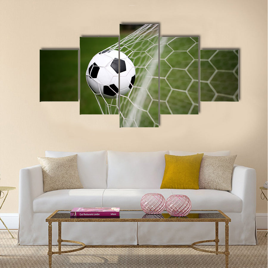 Soccer ball in goal Multi panel canvas wall art