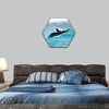 Massive humpback whale playing in water hexagonal canvas wall art