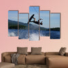 Guy on wakeboard jumping Multi panel canvas wall art