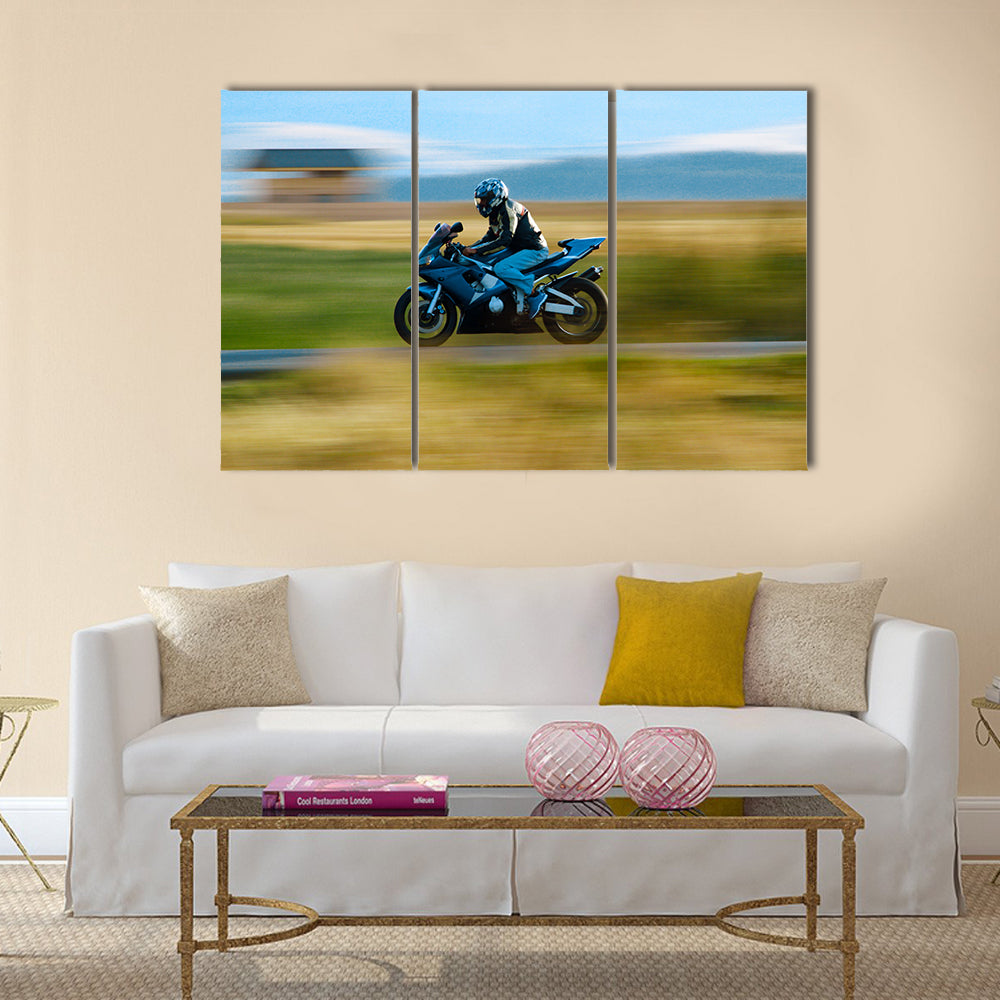 A motorbike speed on the street Multi panel canvas wall art