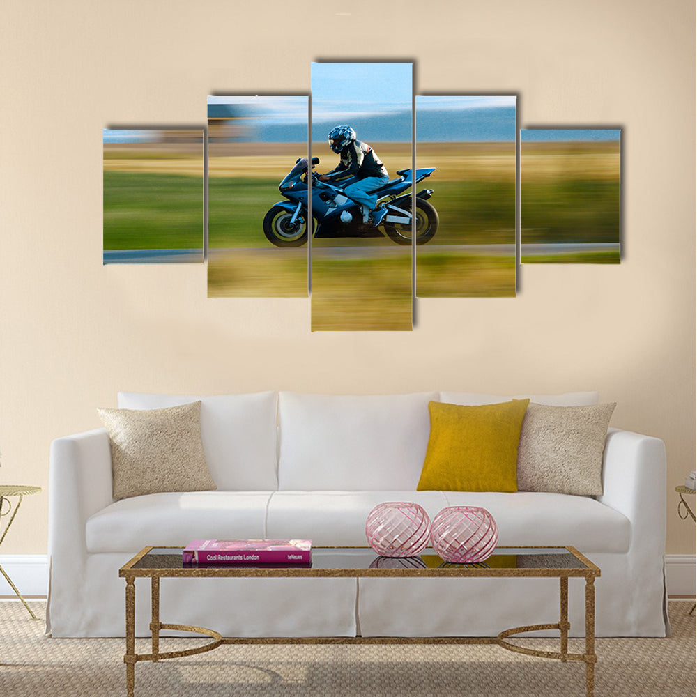 A motorbike speed on the street Multi panel canvas wall art