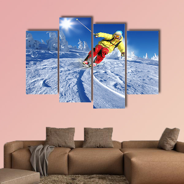 Skier skiing downhill in high mountains Multi panel canvas wall art