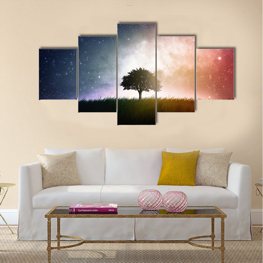 A single tree in a field with beautiful space background Multi Panel Canvas Wall Art