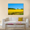 Rapeseed field with forest far away Multi panel canvas wall art