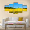 Rapeseed field with forest far away Multi panel canvas wall art