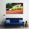 Close up view of tennis racket and balls on the clay tennis court Multi panel canvas wall art