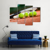 Close up view of tennis racket and balls on the clay tennis court Multi panel canvas wall art