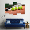 Close up view of tennis racket and balls on the clay tennis court Multi panel canvas wall art