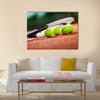 Close up view of tennis racket and balls on the clay tennis court Multi panel canvas wall art