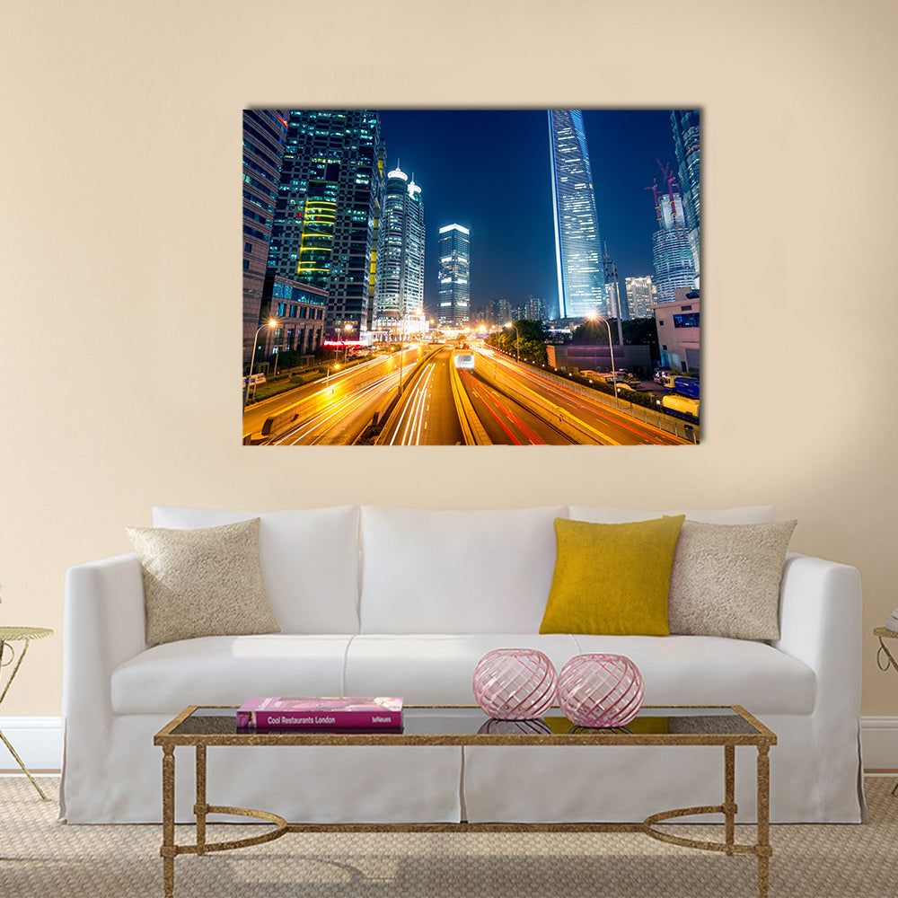 Light trails on the street with modern building background multi panel canvas wall art