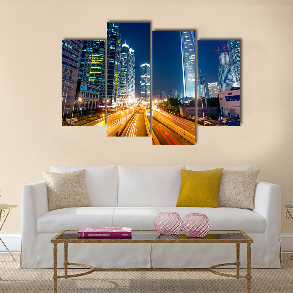 Light trails on the street with modern building background multi panel canvas wall art