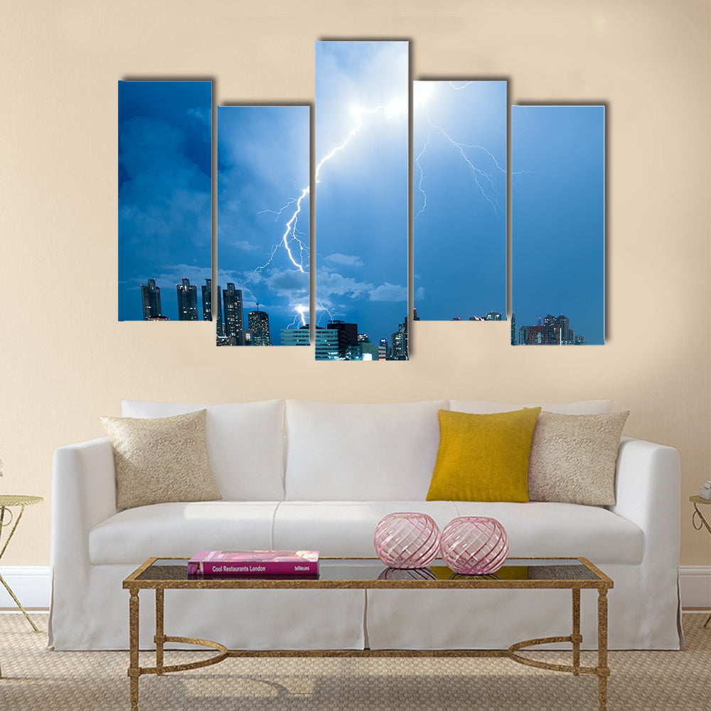 Real lightning bolt strike in a city Multi Panel Canvas Wall Art