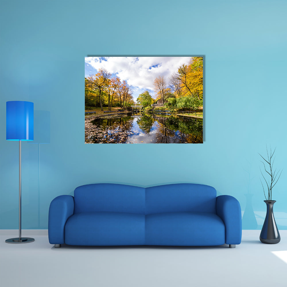 Autumn landscape with reflection of trees in a small lake multi panel canvas wall art