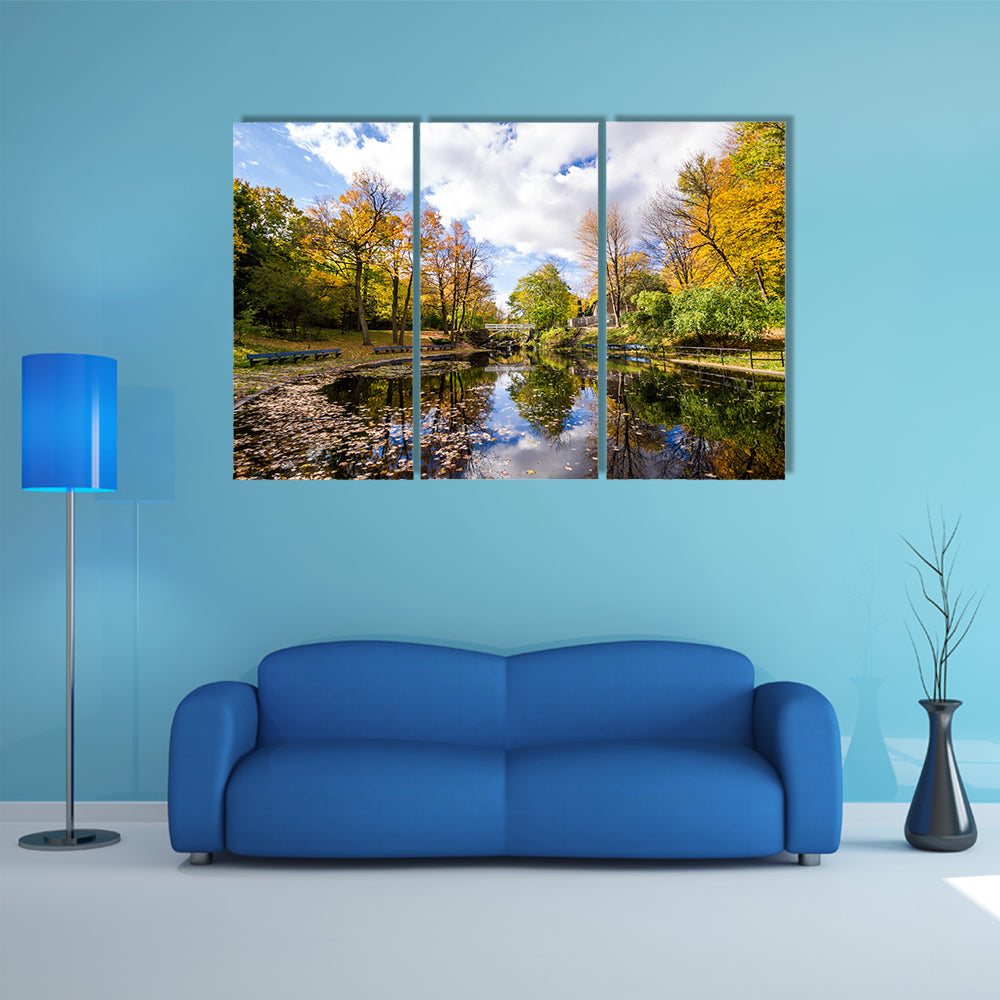 Autumn landscape with reflection of trees in a small lake multi panel canvas wall art