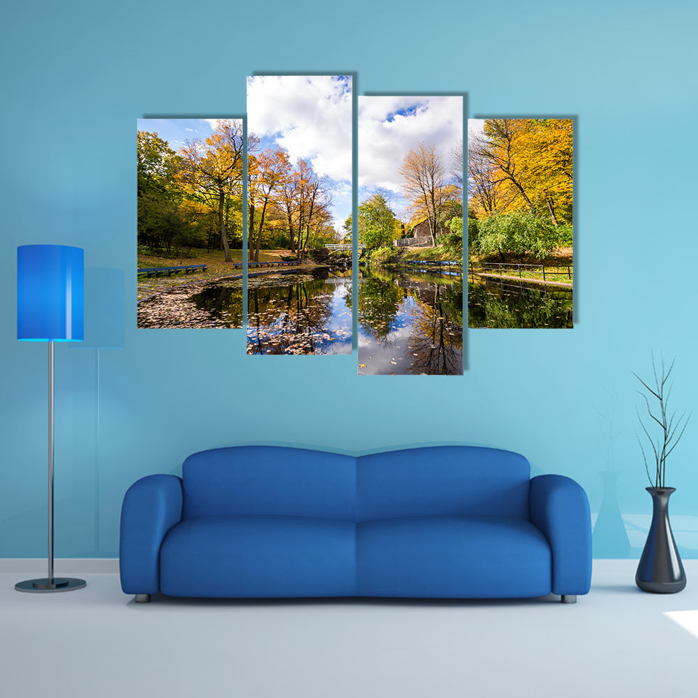 Autumn landscape with reflection of trees in a small lake multi panel canvas wall art