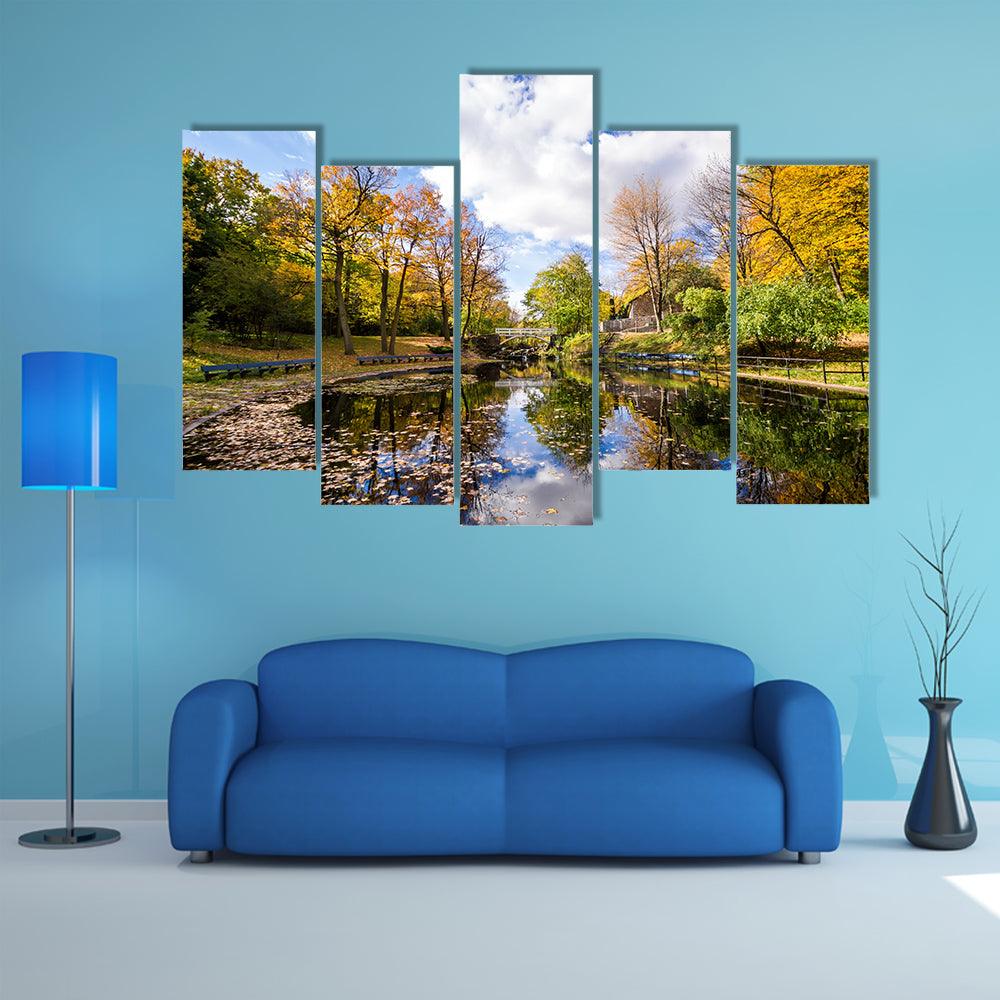 Autumn landscape with reflection of trees in a small lake multi panel canvas wall art