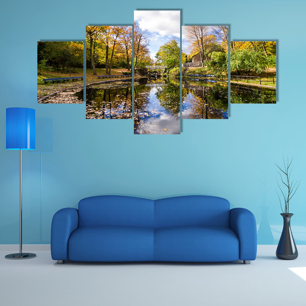 Autumn landscape with reflection of trees in a small lake multi panel canvas wall art