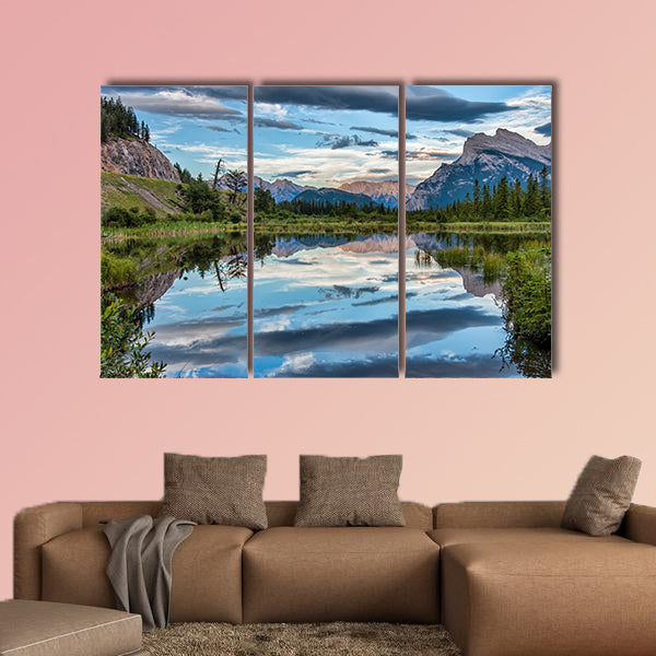 Reflection of dramatic dark clouds in Vermilion Lake outside of the town wall art