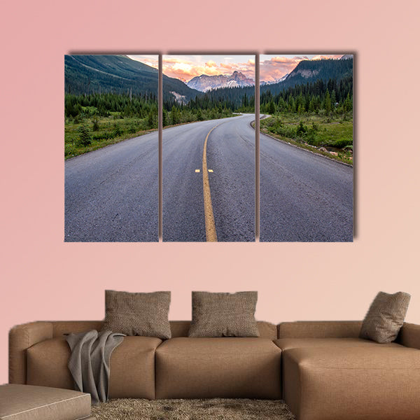 Winding road that leads to beautiful sunset lit mountains wall art
