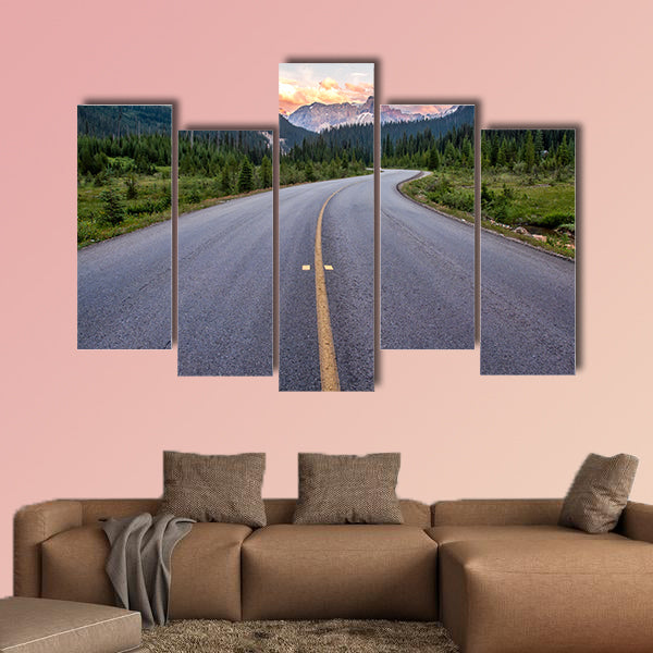 Winding road that leads to beautiful sunset lit mountains wall art