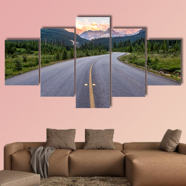 Winding road that leads to beautiful sunset lit mountains wall art
