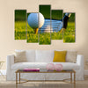 Golf ball on tee in front of driver on a gold course Multi Panel Canvas Wall Art