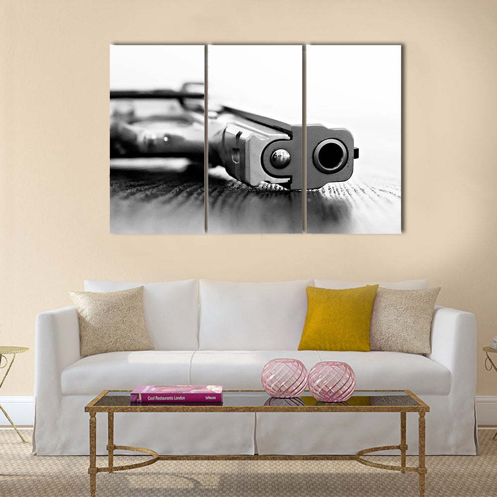 9mm gun resting on table multi panel canvas wall art