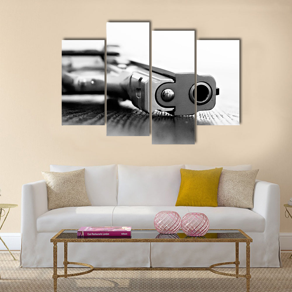 9mm gun resting on table multi panel canvas wall art