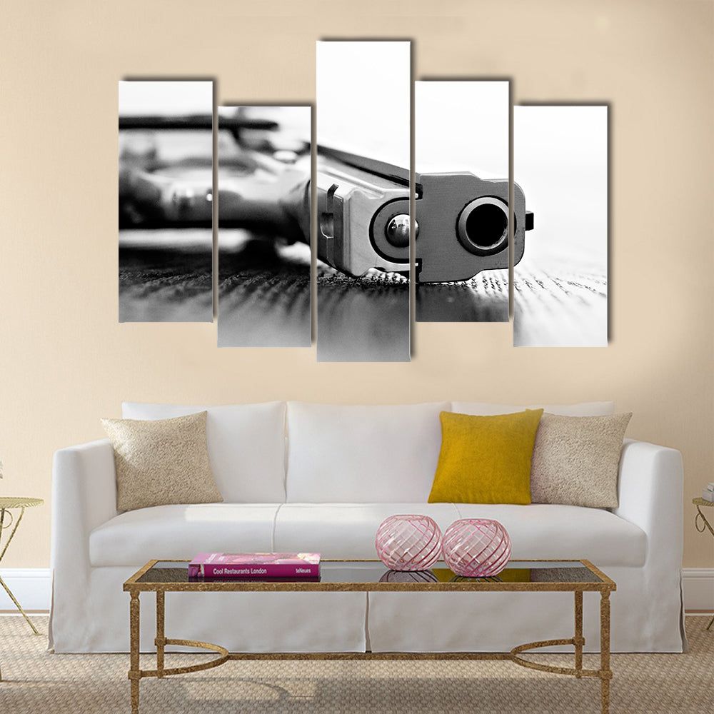 9mm gun resting on table multi panel canvas wall art
