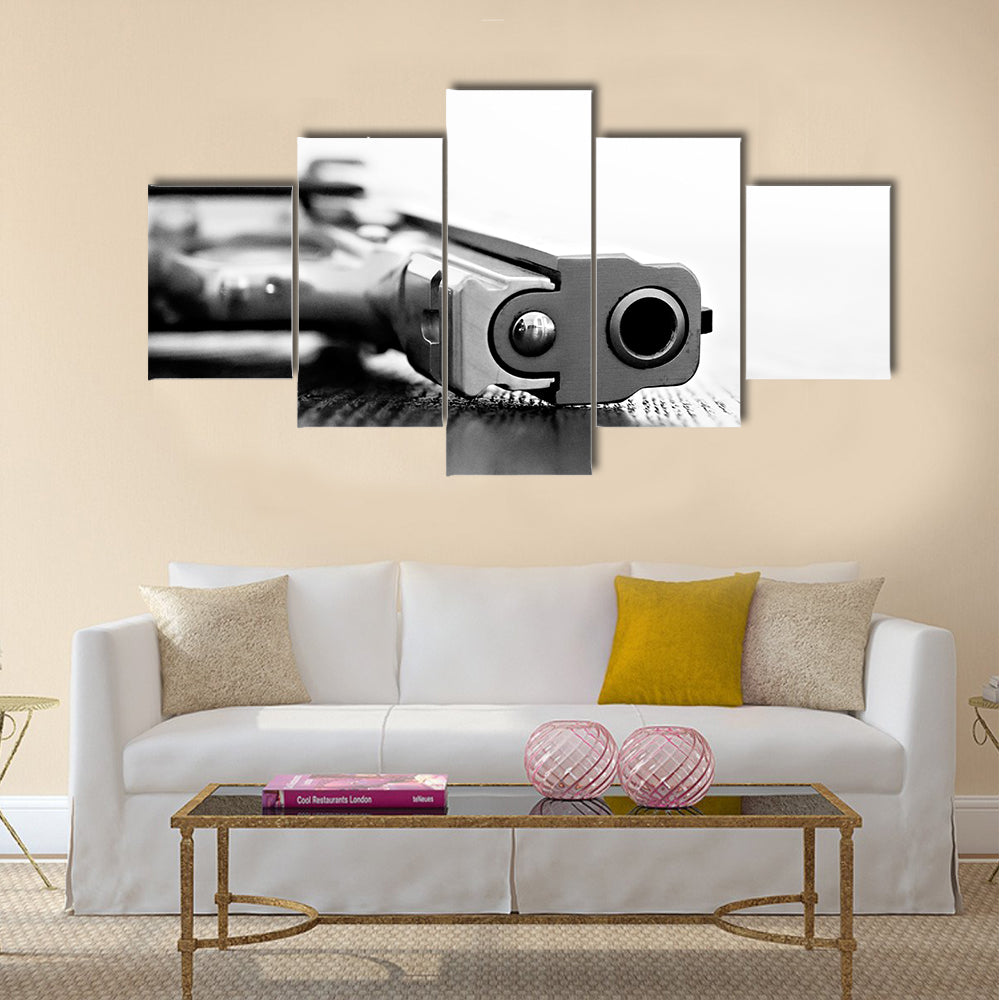9mm gun resting on table multi panel canvas wall art