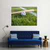 a baseball bat and ball on the grass near a field stripe Multi Panel Canvas Wall Art