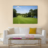 Beautiful golf fairway lined with trees Multi Panel Canvas Wall Art