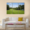 Beautiful golf fairway lined with trees Multi Panel Canvas Wall Art