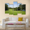 Beautiful golf fairway lined with trees Multi Panel Canvas Wall Art