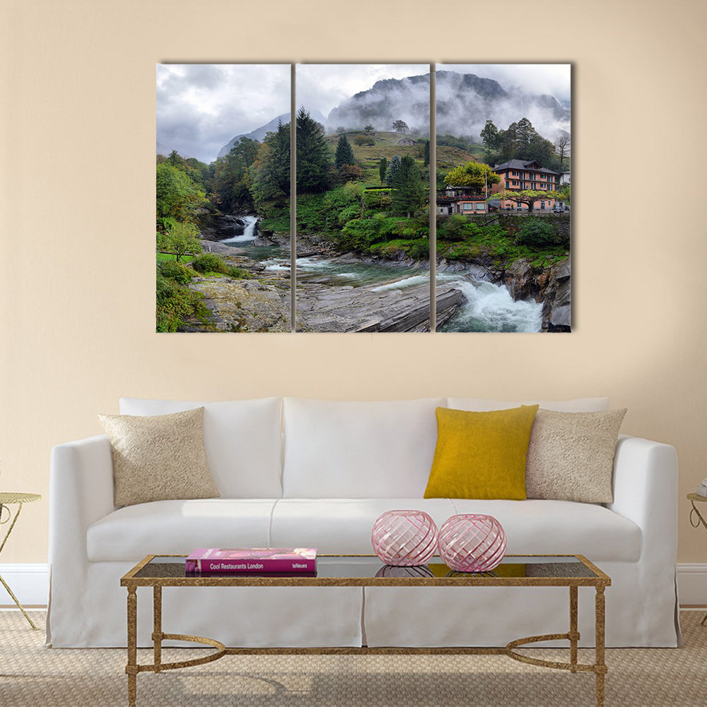 Swiss village in the mountains with mist and waterfall multi panel canvas wall art