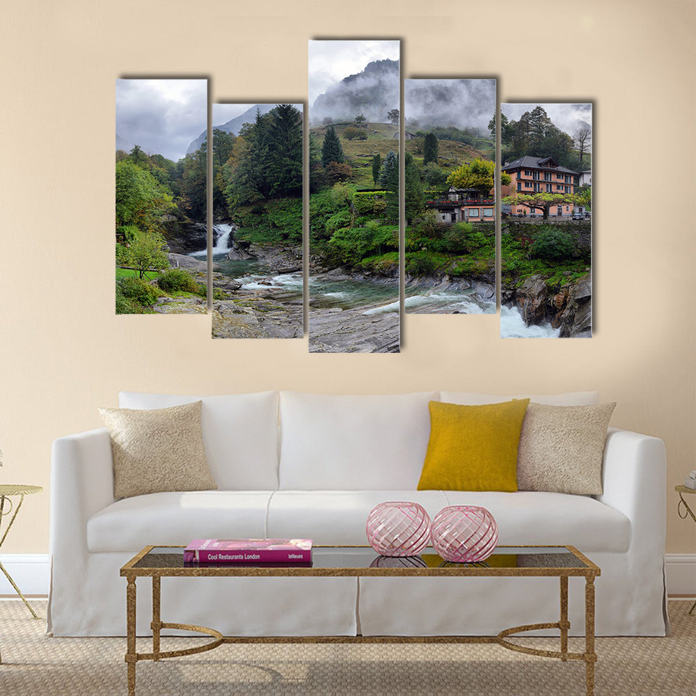 Swiss village in the mountains with mist and waterfall multi panel canvas wall art