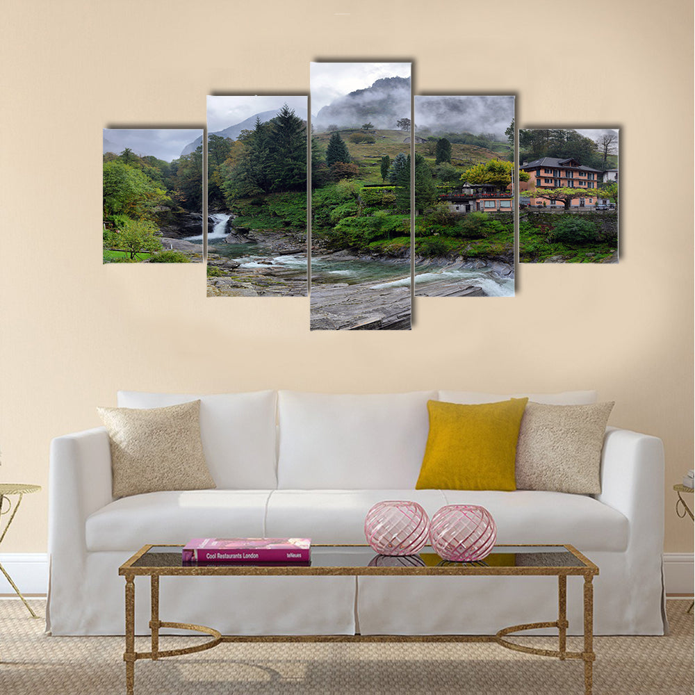 Swiss village in the mountains with mist and waterfall multi panel canvas wall art