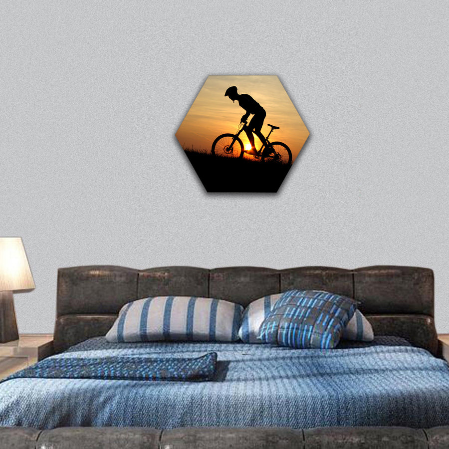 mountain biker silhouette in sunrise hexagonal canvas wall art