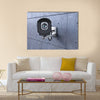 Security camera looking at you on concrete wall Multi panel canvas wall art