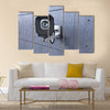 Security camera looking at you on concrete wall Multi panel canvas wall art