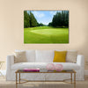 Green golf field with sky Multi Panel Canvas Wall Art