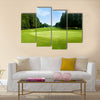 Green golf field with sky Multi Panel Canvas Wall Art