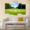 Green golf field with sky Multi Panel Canvas Wall Art