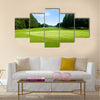 Green golf field with sky Multi Panel Canvas Wall Art