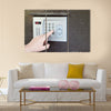 Close-up of uses intercom in steel door Multi panel canvas wall art