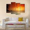 Beautiful view of sea and empty beach with palms on sunset Multi panel canvas wall art