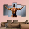 Young bodybuilder showing his biceps on a gray background Multi panel canvas wall art