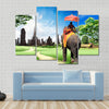 tourists on an elephant Multi panel canvas wall art