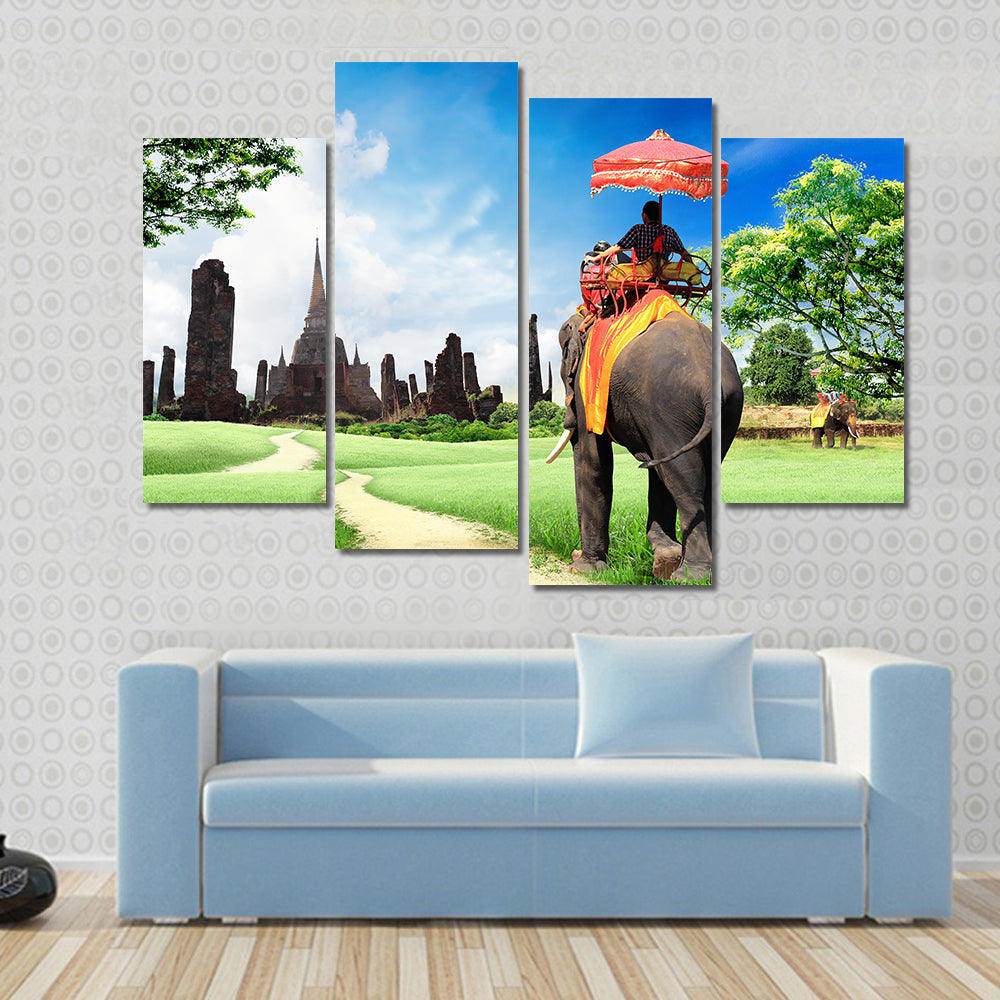 tourists on an elephant Multi panel canvas wall art
