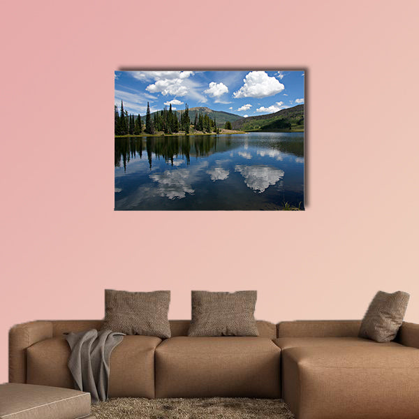 In this scene, afternoon clouds reflect from Pearl Lake multi panel canvas wall art